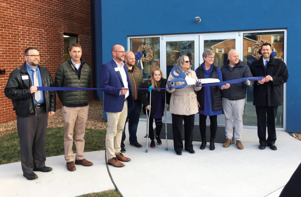 Elementary building celebration. Left to right: Mike Stoltzfus, director of business affairs; Wayne Witmer, Harman Construction; Jeff Shank, EMS board chair; Charles Hendricks, Gaines Group Architects; Marlowe Nichols ‘27; Maria Archer, K-8 principal; Teresa Anders, board of trustees; Frank Oncken, Chamber of Commerce; Paul Leaman, head of school.