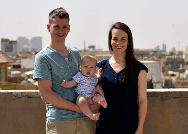 Nathan Hershberger '08, Young Alum of the Year2018, with his wife Katilin Heatwole and Leo on the roof of their house in Ankawa, Iraq. Photo by Joel Carillett.