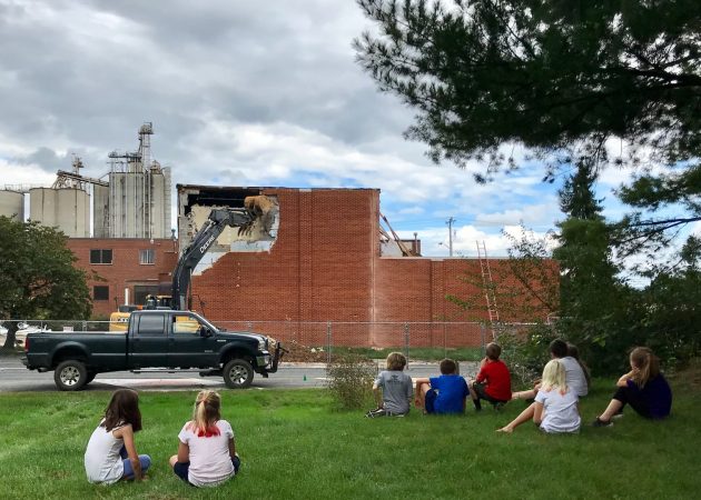 Elementary students watch the demolition of the music studio at the former MennoMedia building, which is being renovated to house Eastern Mennonite K-5 program. Photo by Heidi Byler.