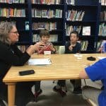 Maria Archer, K8 principal uses a talking piece with 6th grade boys' Neighbor Group.