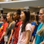 Rehearsal for mass choir, EMHS Touring Choir and guests from other schools at Lancaster Mennonite School