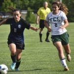 Eastern Mennonite’s Ava Galgano (11) gets ahead of Fredericksburg Christian’s Catie Jones on Wednesday during the Flames’ 2-0 loss in the VISAA Division II girls soccer quarterfinals at EMHS.Jim Sacco / DN-R