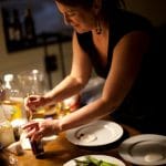 Kirsten Moore prepares plates for a Sub Rosa meal