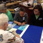 Volunteers -- including aunts, grandmothers, mothers and friends of current students -- helped with the quilting on History Day 2017