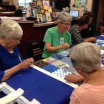 Volunteers -- including aunts, grandmothers, mothers and friends of current students -- helped with the quilting on History Day 2017