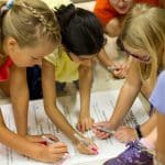 EMES Gathering as children sign the annual Peace Pledge