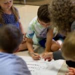 EMES Gathering as children sign the annual Peace Pledge