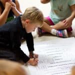 EMES Gathering as children sign the annual Peace Pledge