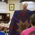 Learning about quilts from area experts on History Day for the centennial quilt project