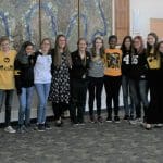 Students wear Mrs. Shannon Roth's (center) Iowa garb.