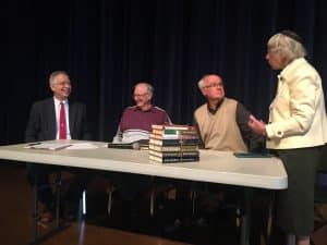 Chapel panel featuring, left to right, Elwood Yoder (moderator), James Rush, Leo Heatwole, Lois Bowman Kreider, 2019