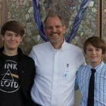 Christian Early, PhD, from James Madison University, and chapel speaker, with sons Joshua '24 (left) and Oliver '26 (right).