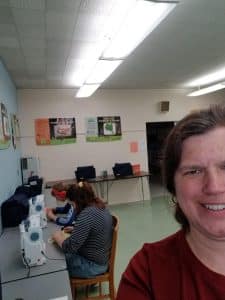 Rebecca Yutzy, learning support services teacher, with her own students (one alum, one EMS) on a sewing project