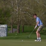 Eli Drooger '22 eyes his putt in a 2019 match.