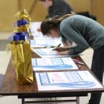 Teachers and staff signed yard signs for the class of 2020