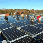 Volunteers install solar panels at Gift and Thrift, December 2019. Photo courtesy Green Hill Solutions. 