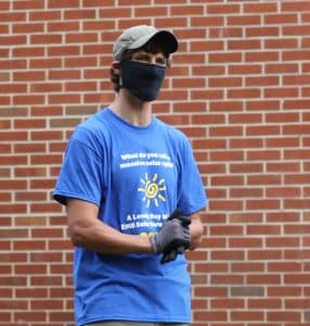 Andy Hershberger '03, of Got Electric, LLC, gives instructions at the solar barn raising