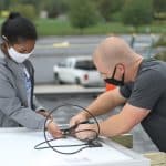 Rahel Lema '21, and Everett Brubaker '13 at the solar barn raising