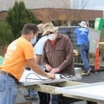 Jeff Heie, communty volunteer coordinator, and Earl Martin at the solar barn raising