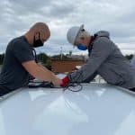 Everett Brubaker '10 and Tony Smith of Secure Futures at the solar barn raising