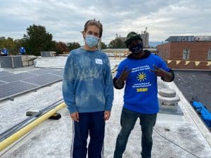 Noah Heie, community volunteer, and Nikita Stoll '14 and employee of Got Electric, LLC