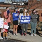 Flames fans send off the boys varsity basketball team to the state semi final game