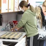 Student bakers preparing items for golfer goodie bags