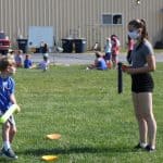 Eighth grade helps with games at elementary field day