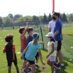 Eighth grade helps with games at elementary field day