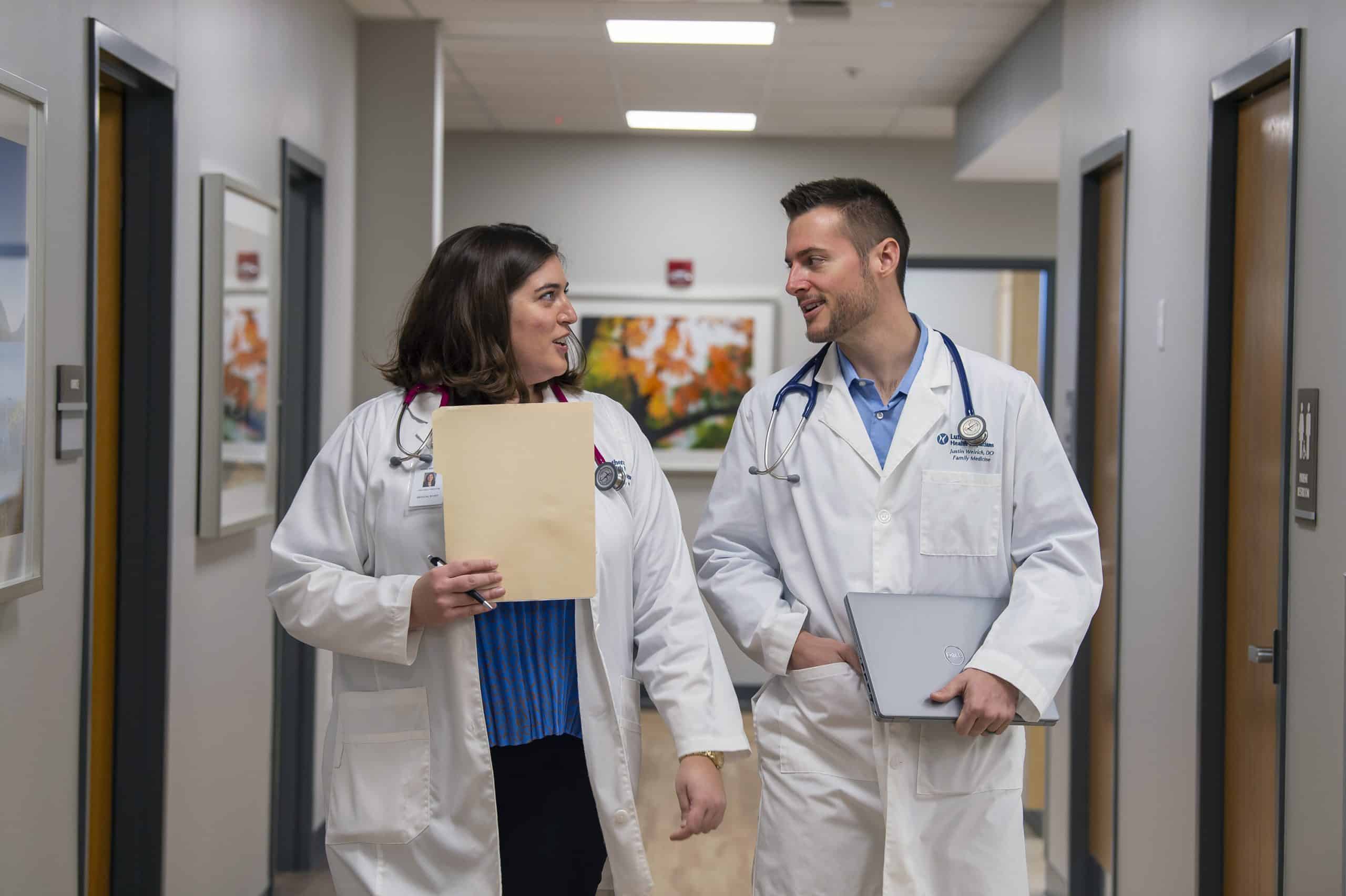 Dr. Justin Weirich 'o6 (right) with a colleague at Lutheran Health Physicians, Fort Wayne, Ind. Photo credit Tim Brumbleloe.