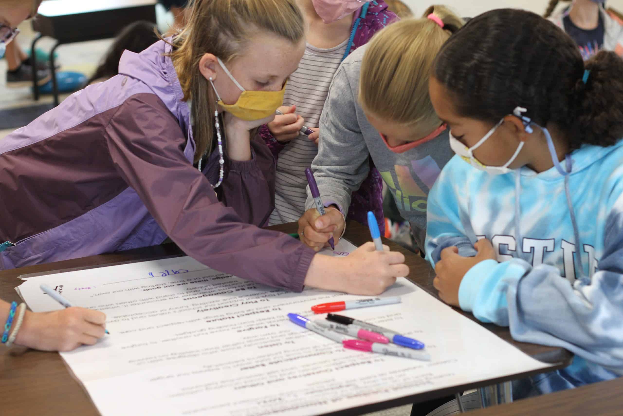 Fifth grade students sign the elementary school peace pledge, fall 2021