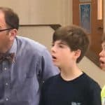 Mr. Stutzman sings with two middle school boys.