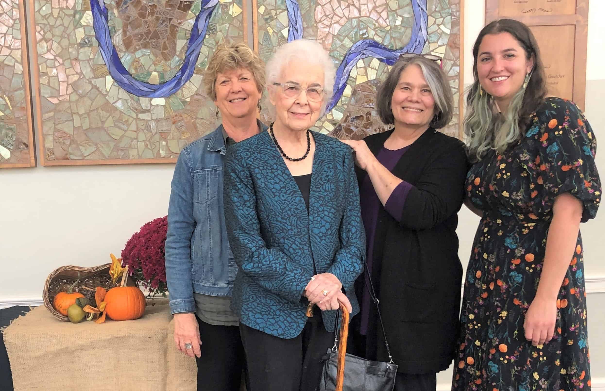 Gloria Diener (former English teacher), Esther Augsburger, Barbara Gautcher (art teacher for 32 years), and Malea Gascho (current art teacher) after an October 2022 Chapel honoring Esther's contribution to the art program at EMS. 