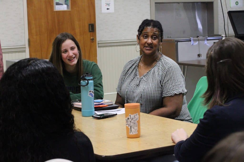 Debbie Katz, high school counselor, with students