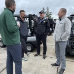 Trevor Parmer '90, far right, co-chair of the golf tournament planning committee. 