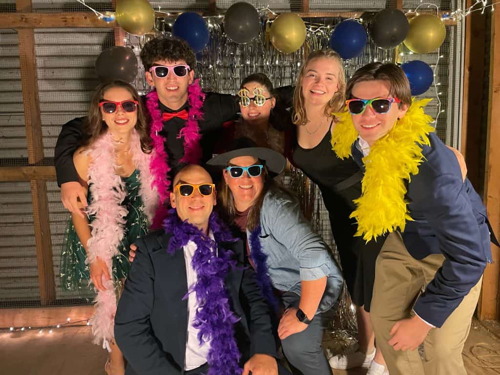 SCO fall formal, 2022. Luke Rogers, SCO president, back left with dark pink boa