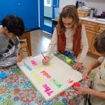 Title: Cozy FireSize: 24”x18”Medium: acrylic paintDescription: 4th grade artists brainstormed and voted on an inspirational saying to serve as the centerpiece of their painting. Next, they collaborated to determine the color scheme and design. This was an important exercise in both sharing and listening respectfully. Students worked in small groups to draw and paint the composition. As the final step in their creative process, the class brainstormed title ideas for their piece then voted for their favorite.