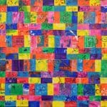 Title: Rainbow ShadowsSize: 24”x18”Media: paper, acrylic paintDescription: 3rd grade artists each painted four 4x4 squares of paper a solid background color (chosen from the project color scheme), then used a variety of tools such as spools, wooden blocks, and lids to create patterns and implied textures. The large squares were cut into a series of squares and rectangles. Students adhered their individual pieces onto a cradled wooden panel, intermingled with those of their classmates, arranging them into a quilt pattern. As the final step in their creative process, the class brainstormed title ideas for their piece then voted for their favorite.