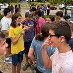 Students gather and socialize outside.