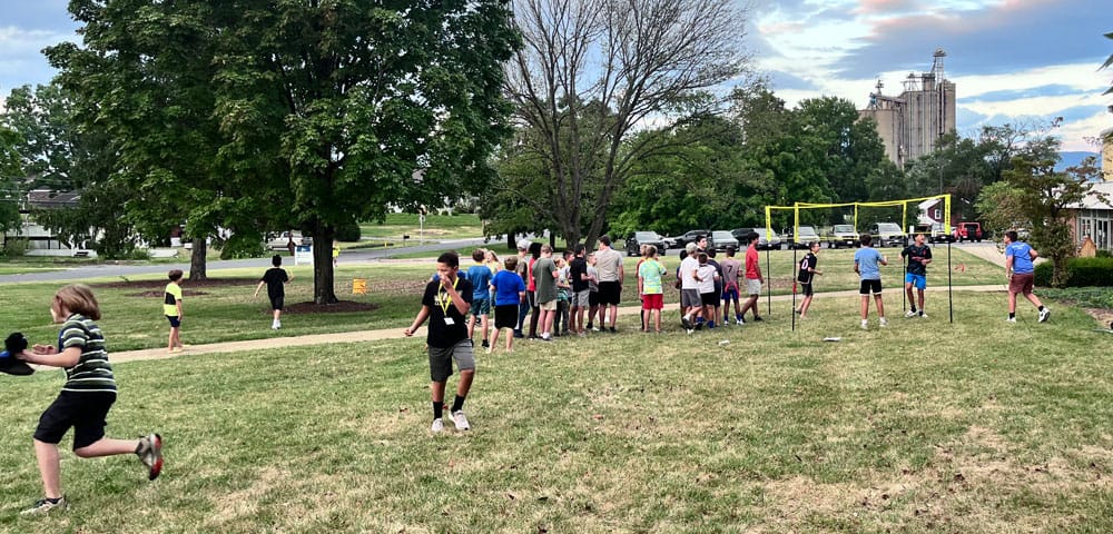 Students gather and play games in the front of the school during back to school night 2024.