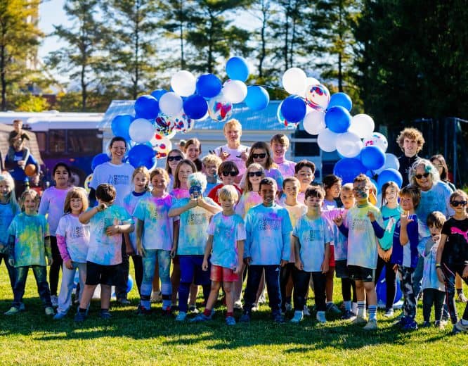 Students covered in colored chalk after their run!